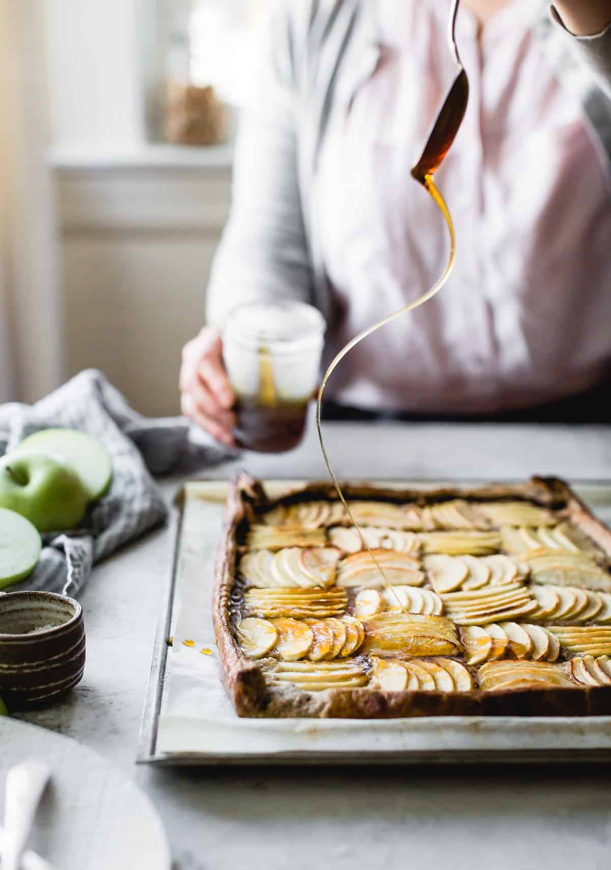 pouring syrup on Buckwheat Apple Galette with Maple Walnut Frangipane {gluten-free, refined sugar-free}