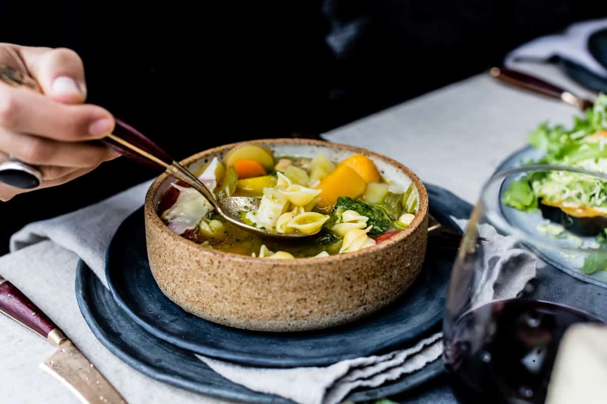 spoonful of Golden Vegetable Chickpea Minestrone with Lemon Parsley Oil