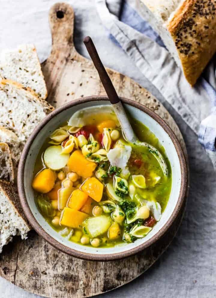 a bowl of Golden Vegetable Chickpea Minestrone with Lemon Parsley Oil