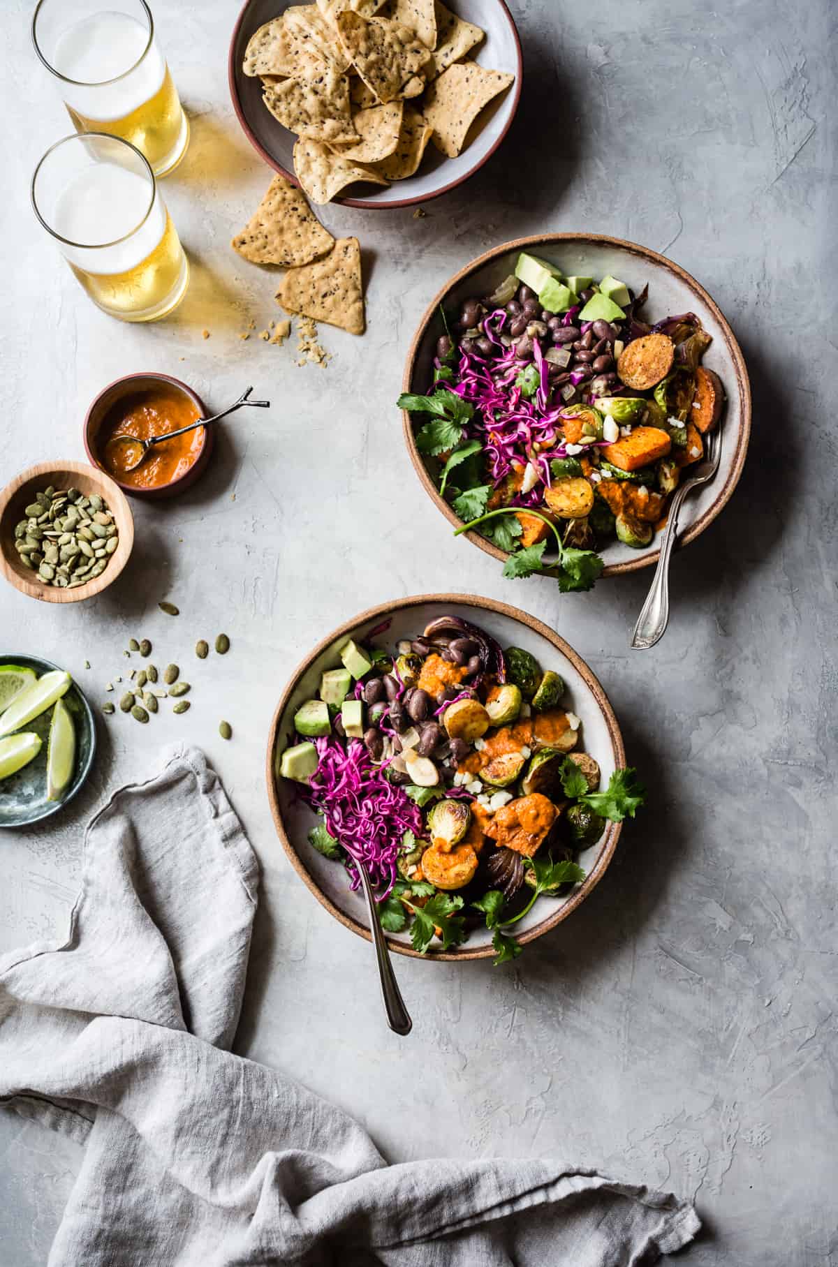 top down shot of Mexican Roasted Veggie Bowls with Beer Beans