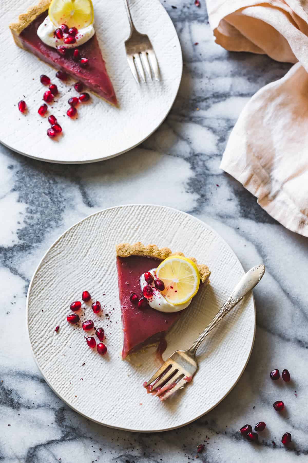 slices of Pomegranate Tart with Hibiscus, Lemon, and Almond Flour Crust {gluten-free}