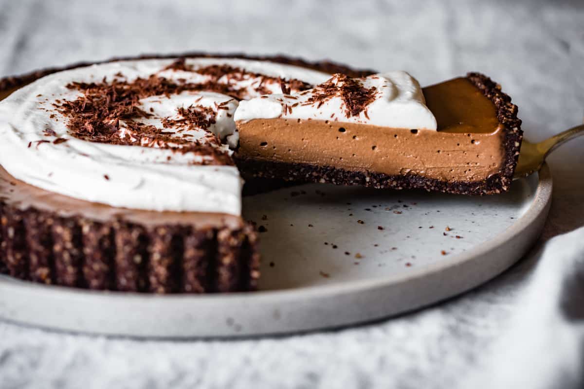 serving a slice of No-Bake Chocolate Cream Tart {vegan, gluten-free, grain-free, refined sugar-free}