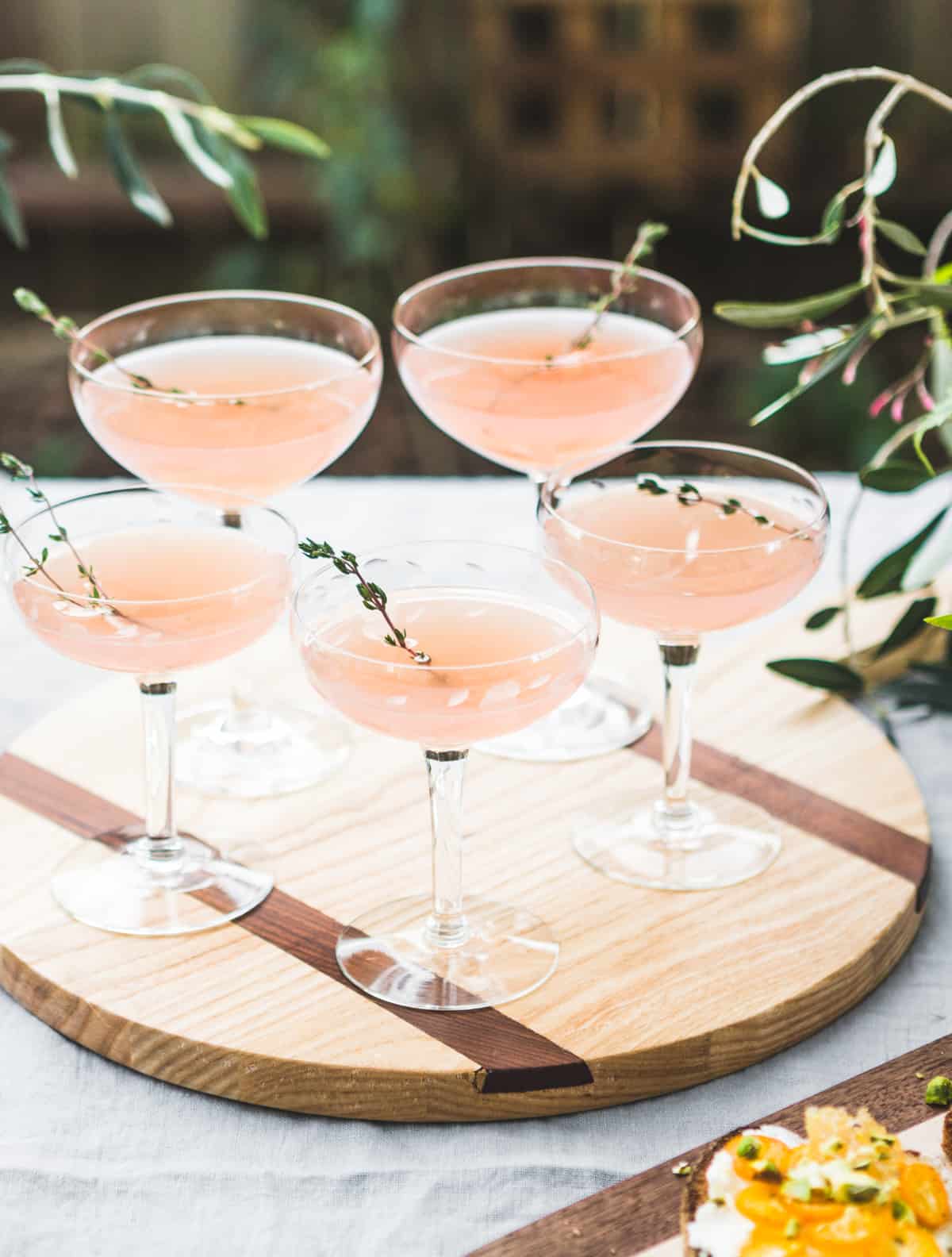 glasses of Sparkling Grapefruit, Elderflower & Rosé Vodka Cocktail on tray 