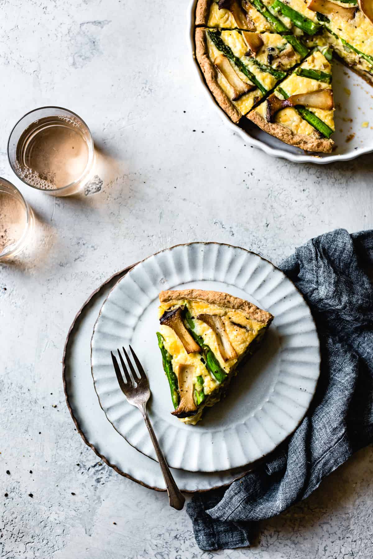 a slice of Cheddar Mushroom Asparagus Quiche & Gluten-Free Ghee Piecrust