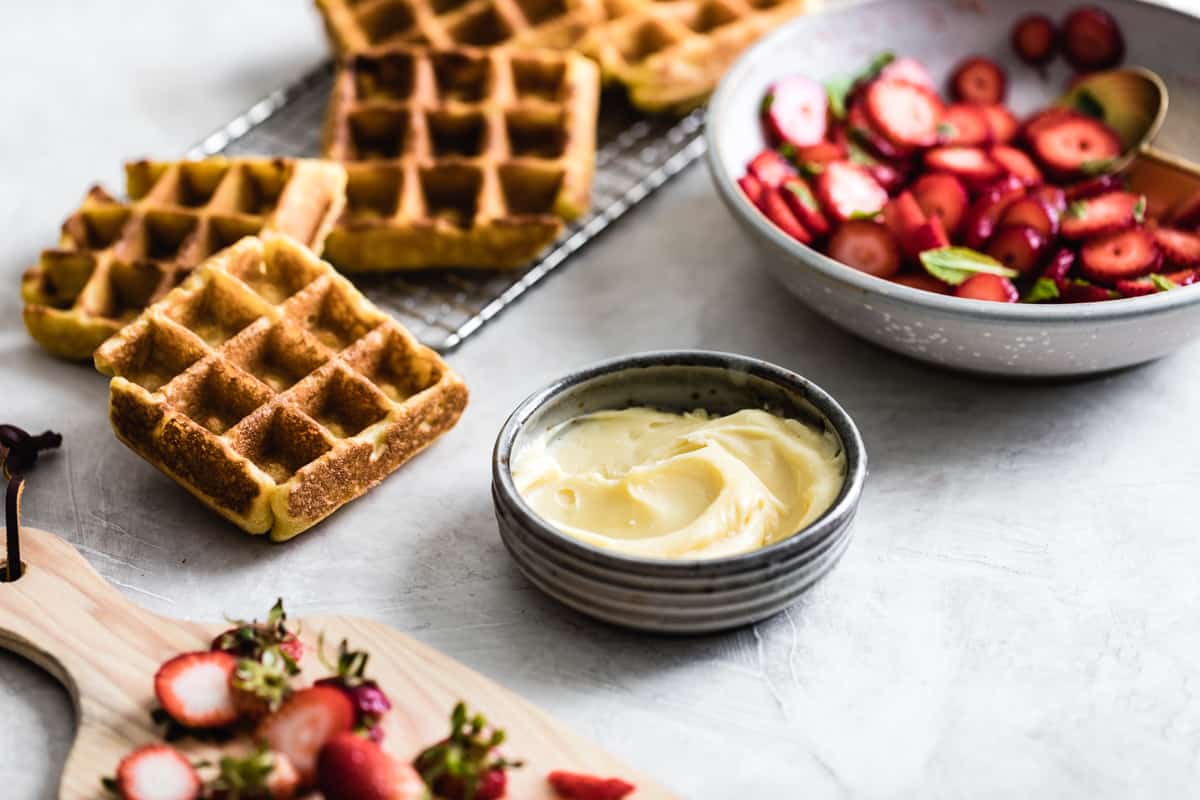 Corn Flour Waffles with Whipped Honey Ghee and Berries {gluten-free} on table 