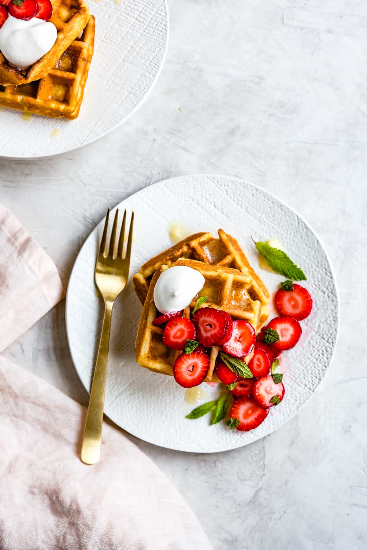 Corn Flour Waffles with Whipped Honey Ghee and Berries {gluten-free} on plate with fork 