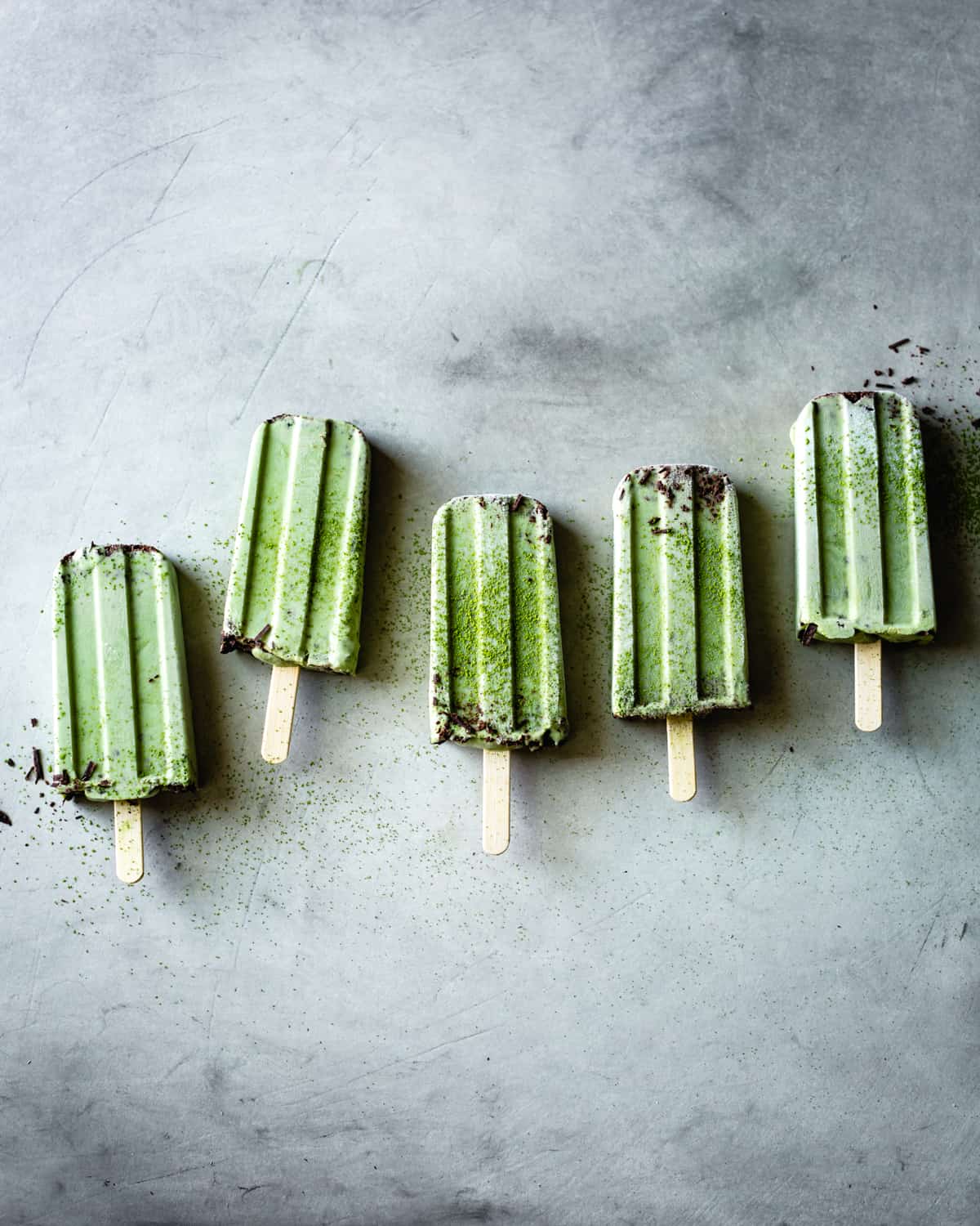 Matcha Mint Chip Popsicles in a row {vegan}