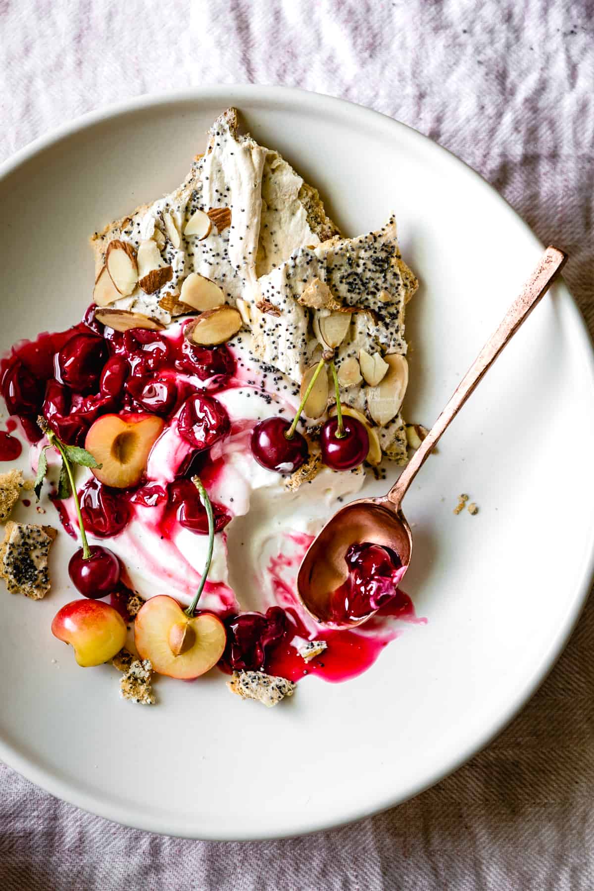 Tart Cherry Eton Mess with Poppy Seed Almond Meringues with spoon 