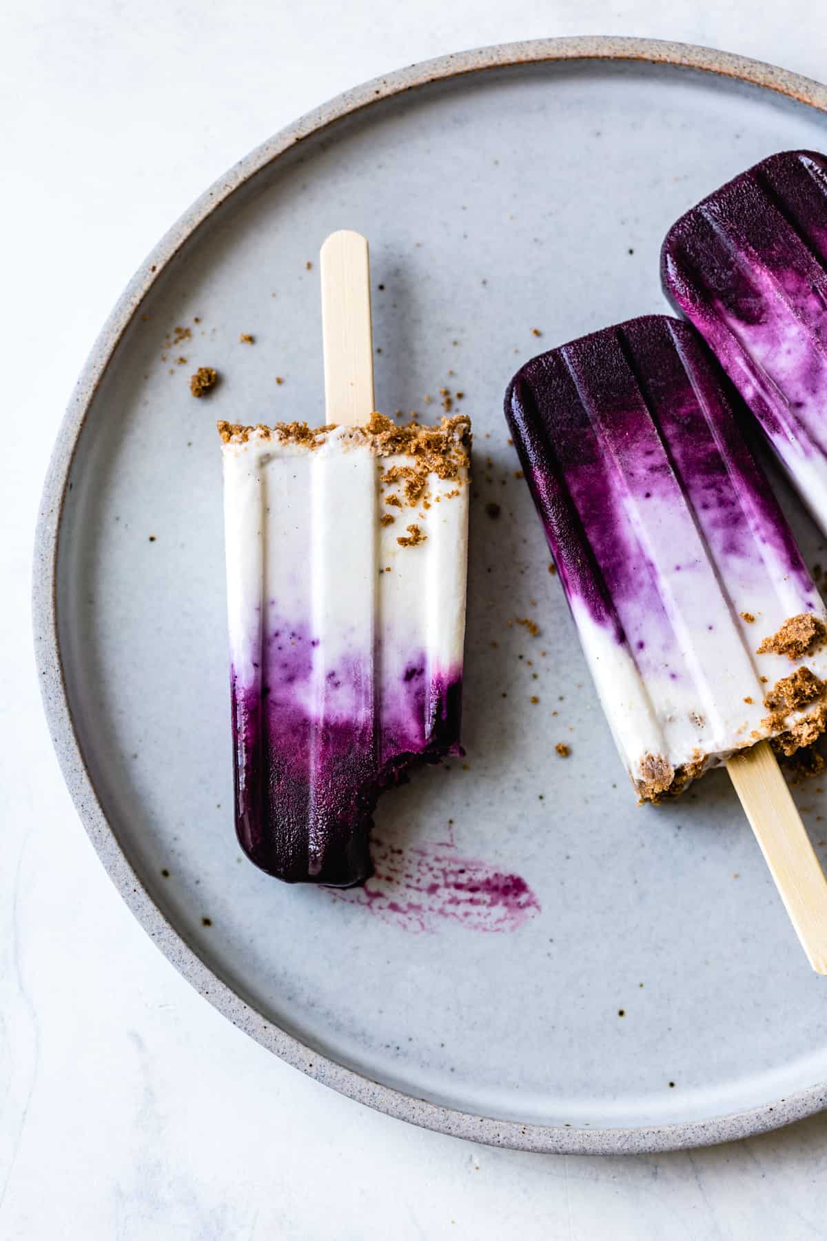 overhead shot of Blueberry Chèvre Cheesecake Popsicles