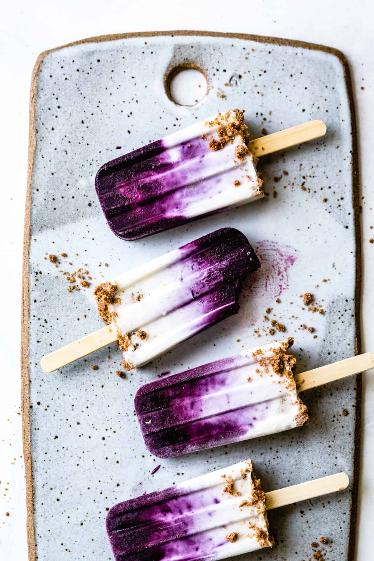 Blueberry Chèvre Cheesecake Popsicles on tray 
