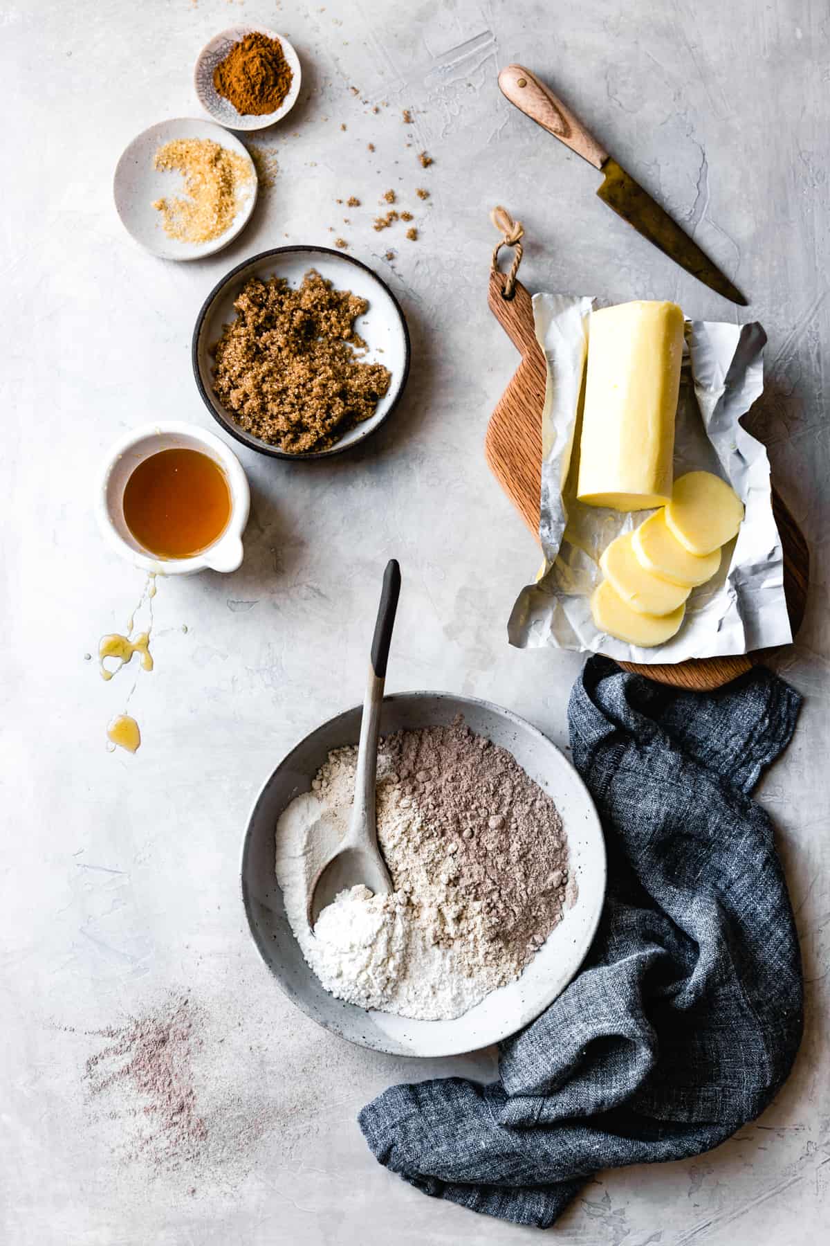 graham cracker ingredients are arranged on a plaster surface