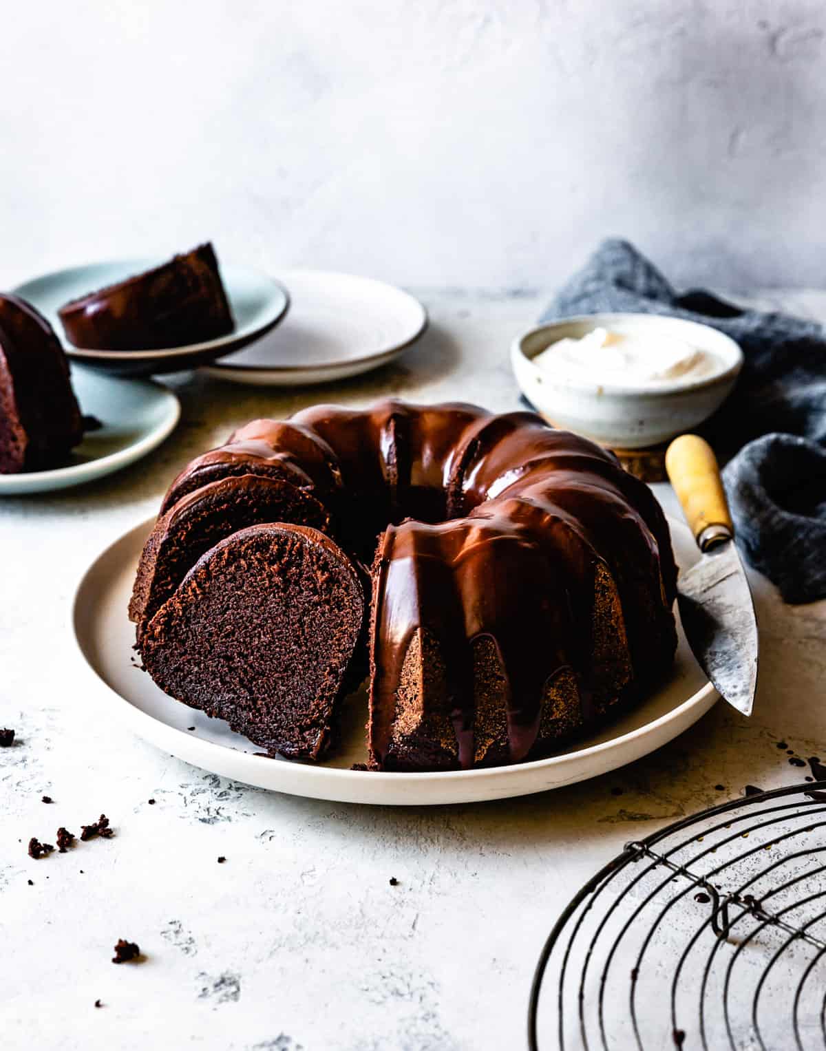 A slice of cake has been cut out of the bundt cake, ready to serve