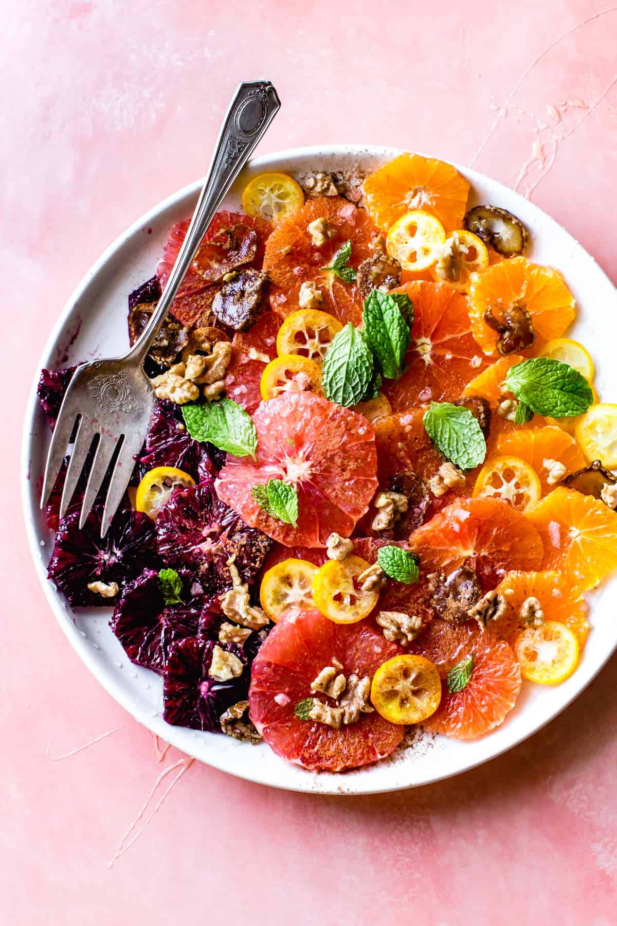 overhead shot of delicious Winter Citrus Salad with Walnuts, Dates & Rose