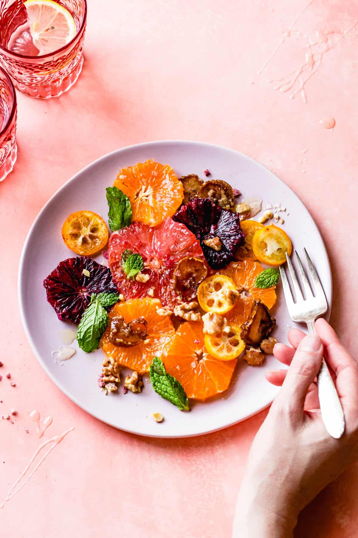 fork and plate of Winter Citrus Fruit Salad with Walnuts, Dates & Rose