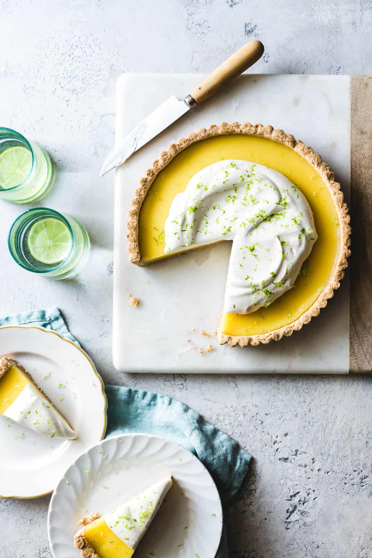 Gluten Free Lime Curd Tart with slices cut out 