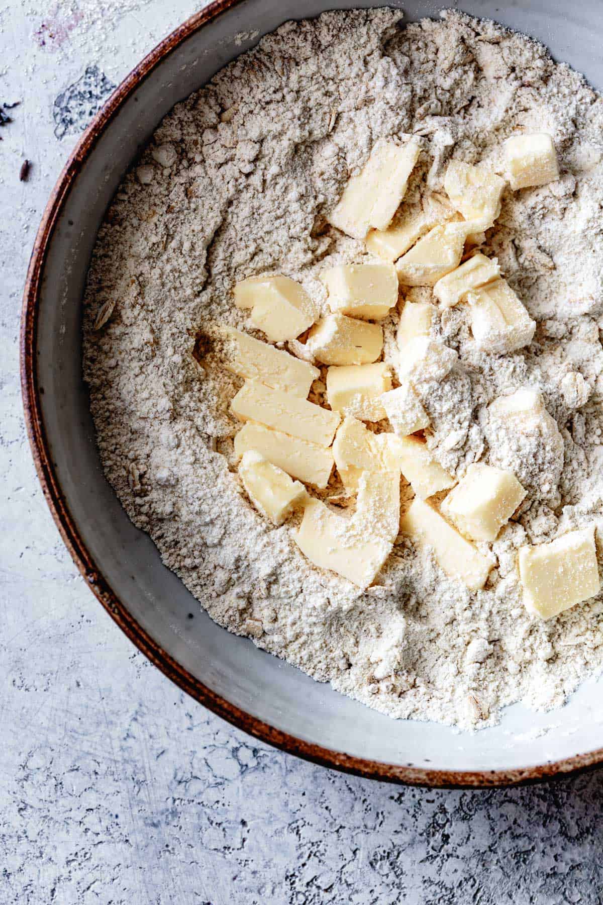 butter and flour in bowl for gluten-free cobbler biscuits