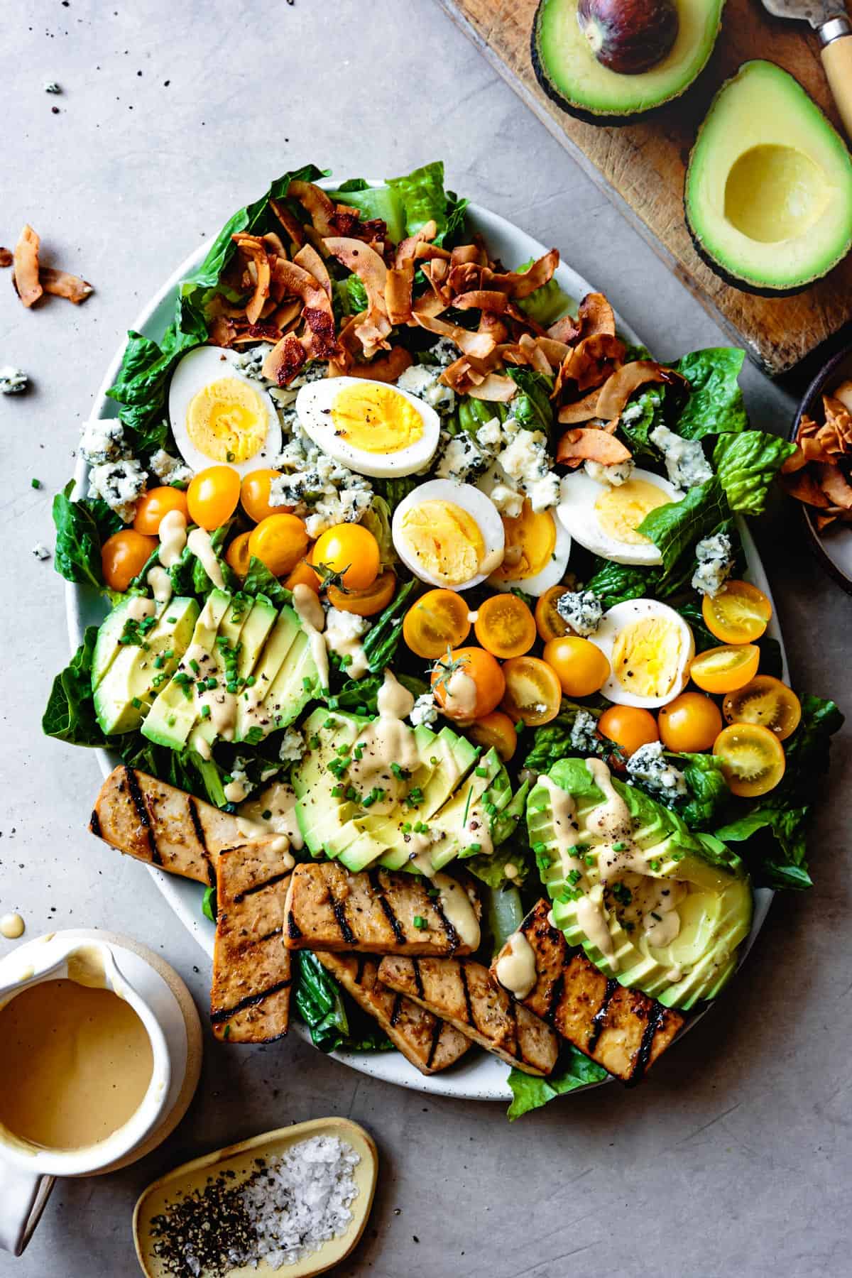 Vegetarian Cobb Salad with Grilled Tofu & Coconut Bacon on table 