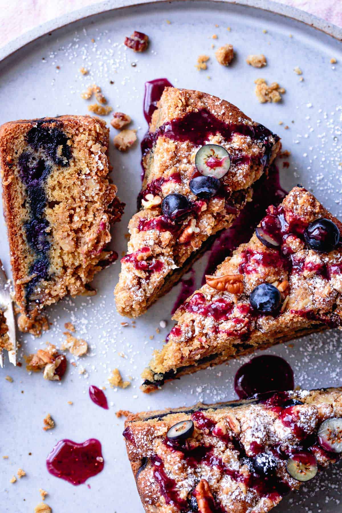 Gluten Free Blueberry Coffee Cake with blueberry glaze on a plate