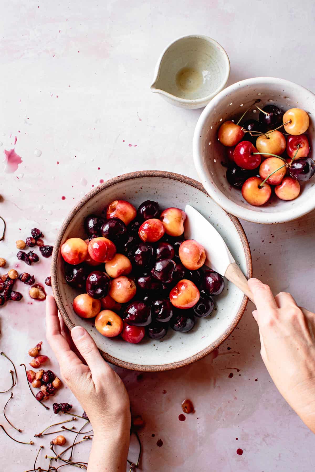 tossing cherries in whiskey for gluten free clafoutis