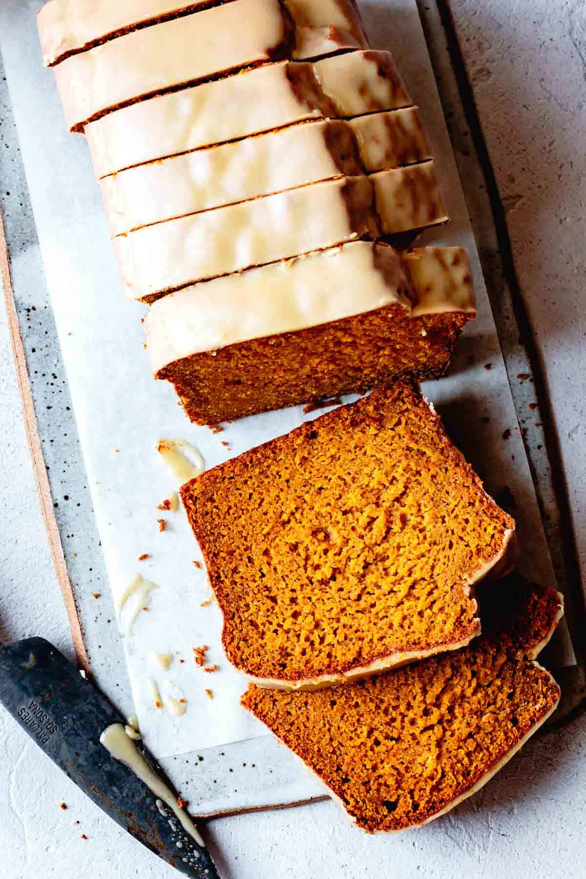 Gluten-Free Pumpkin Bread, sliced on a board