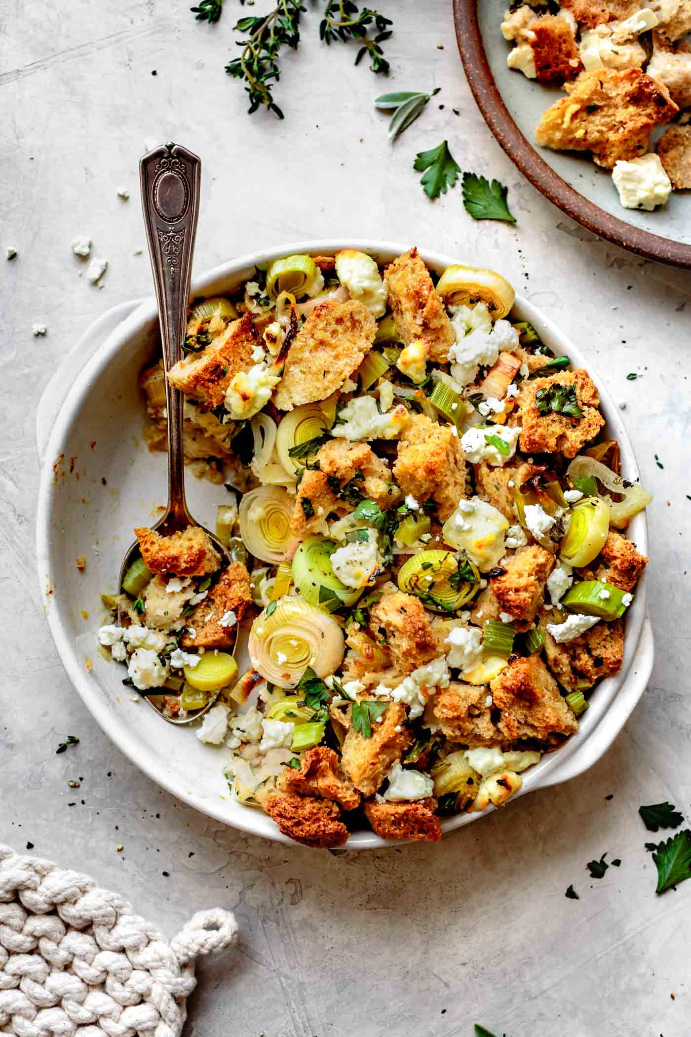 GF stuffing recipe with leeks and goat cheese in a pan