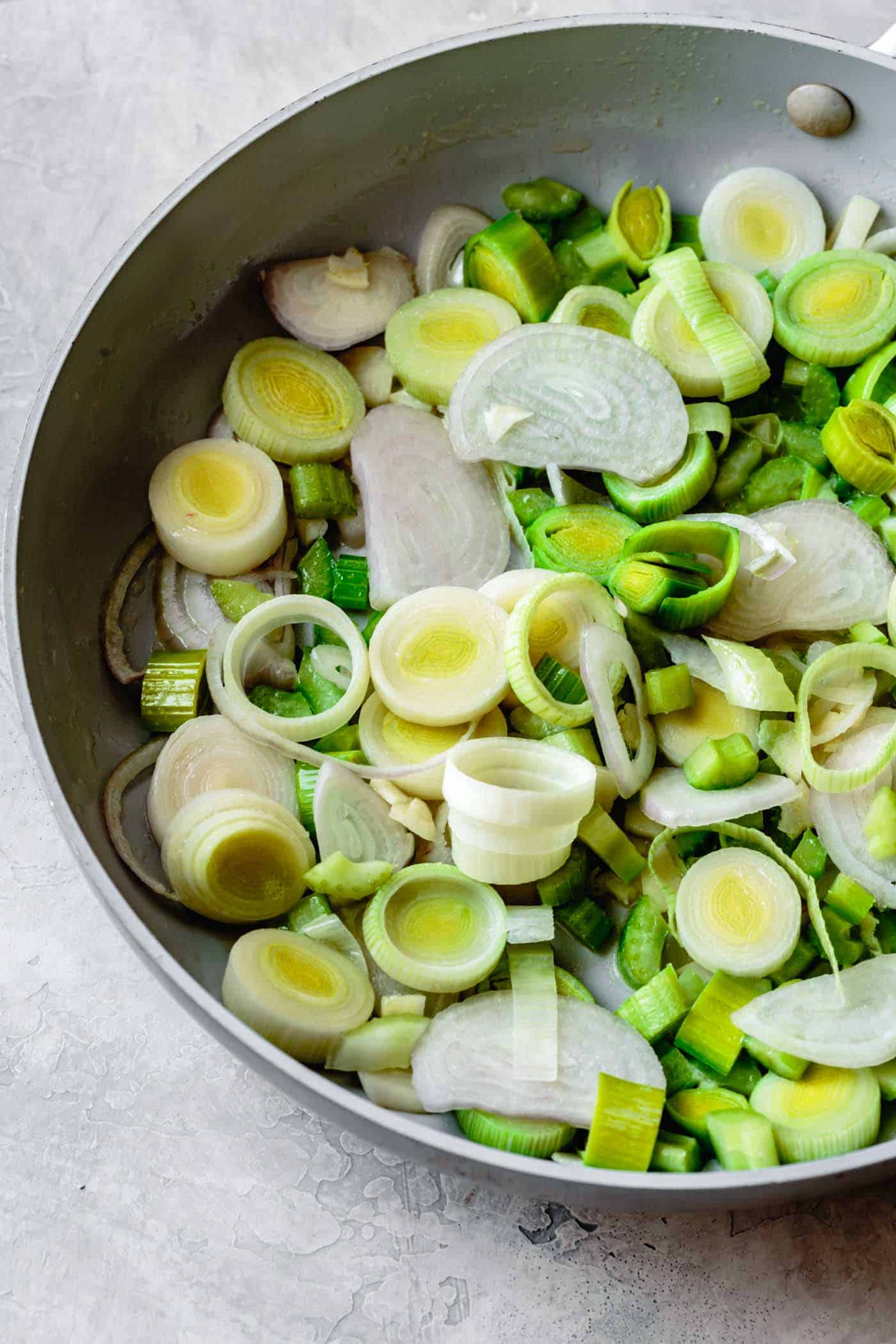 Cooking leeks, shallots, and celery for simple gluten-free stuffing recipe