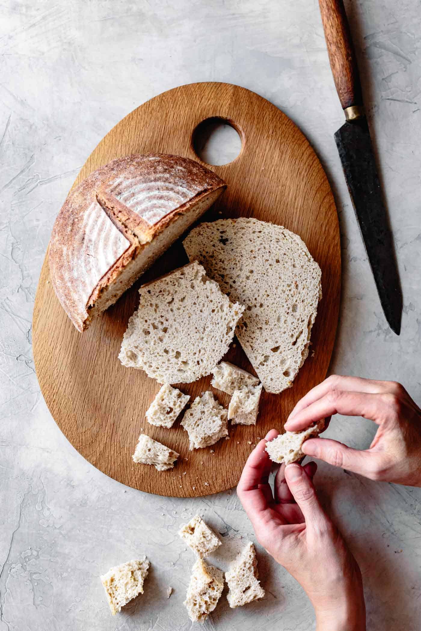 Tearing bread cubes for gluten-free stuffing recipe