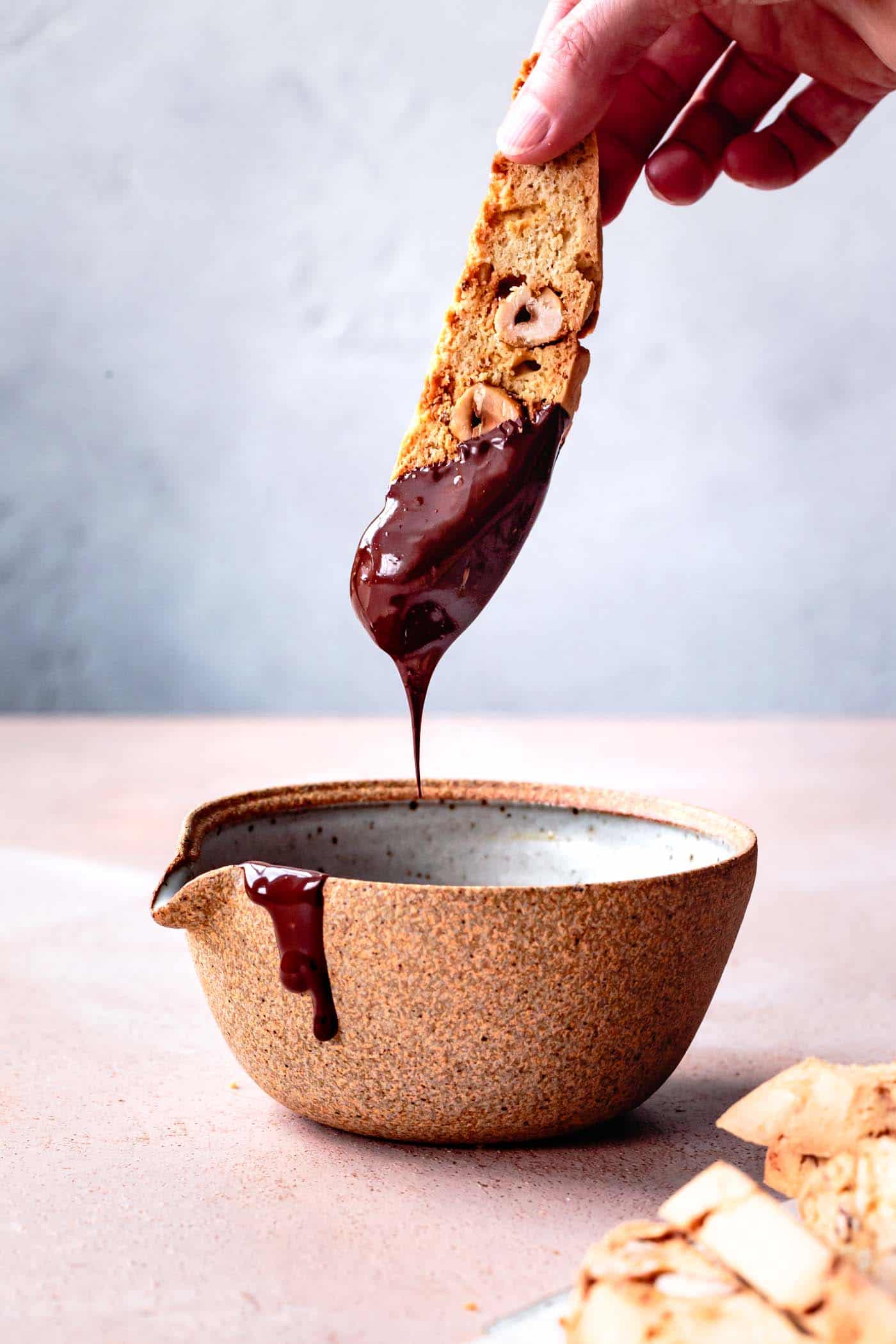 Dipping gluten-free biscotti in chocolate