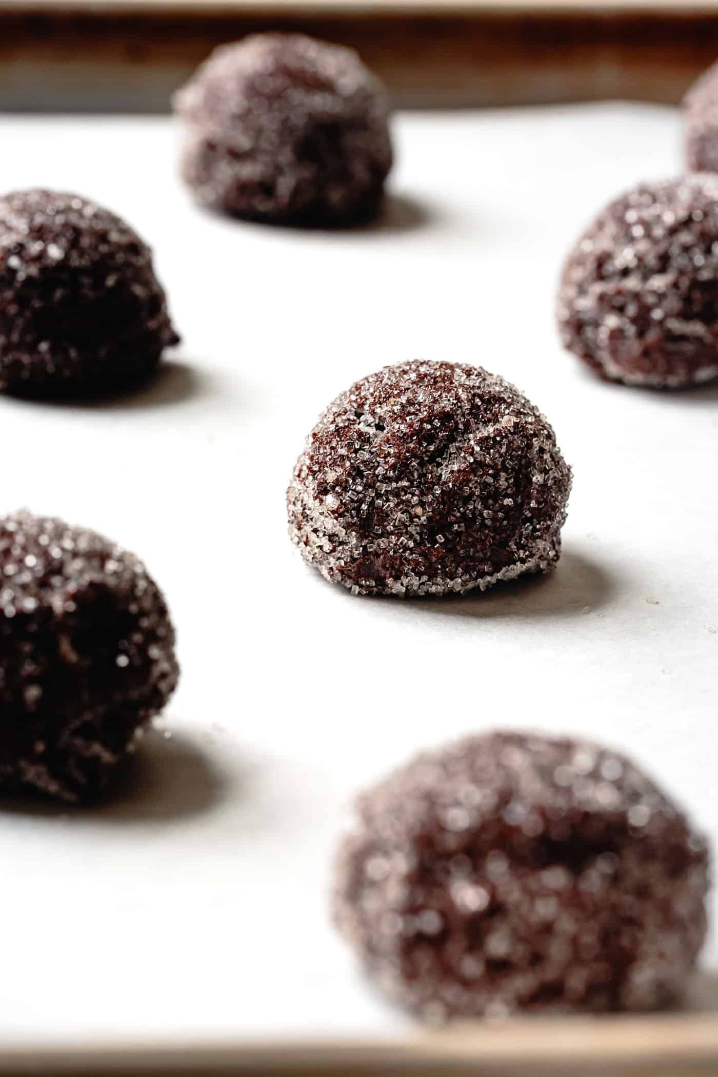 Gluten-Free Chocolate Ginger Cookie dough rolled in sugar, ready for baking