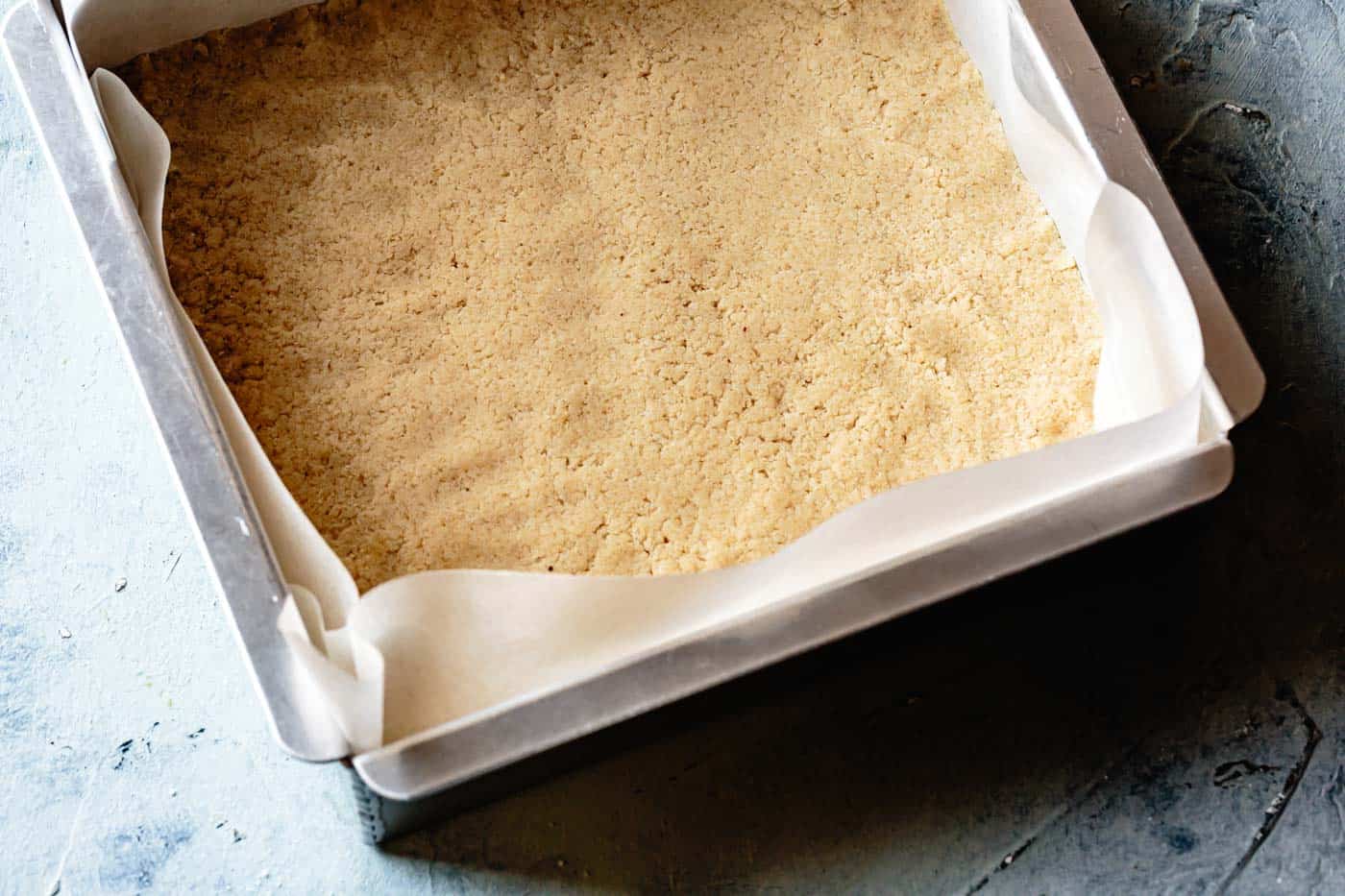 gluten-free shortbread crust pressed into a pan