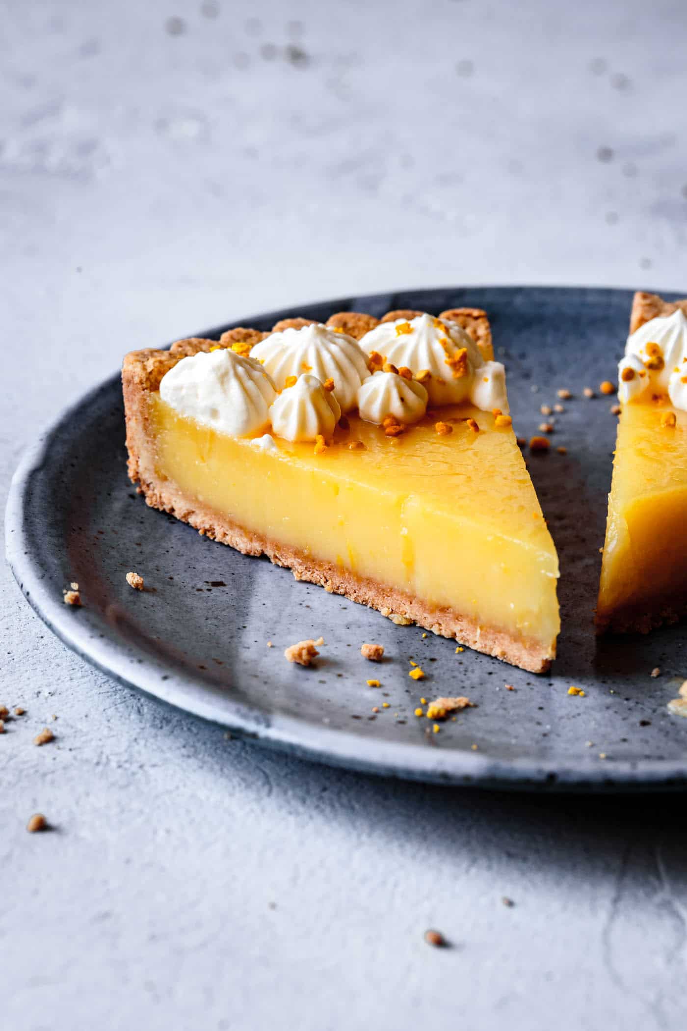 easy lemon tart recipe, sliced on a plate