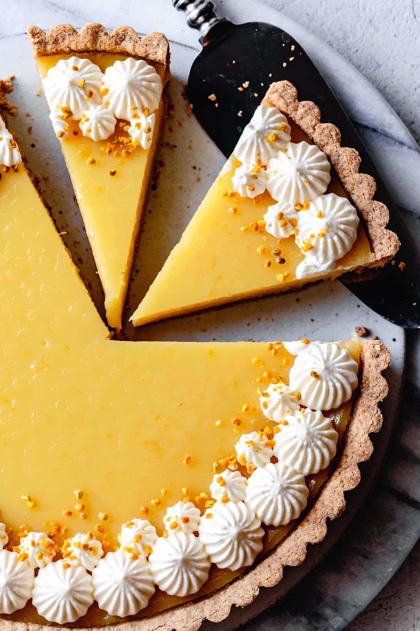 close-up on sliced easy gluten-free lemon curd tart