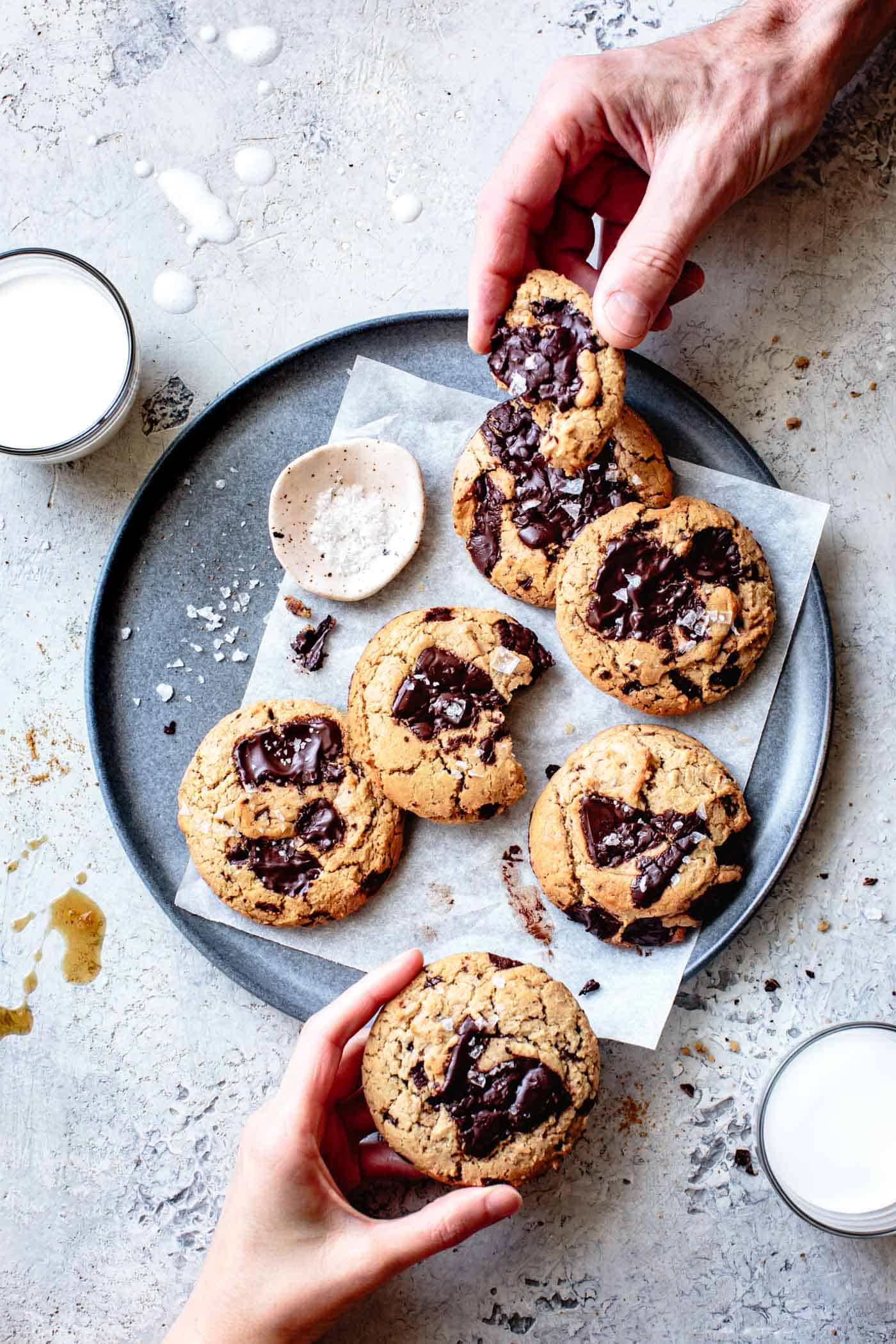 two people eating vegan paleo cookies