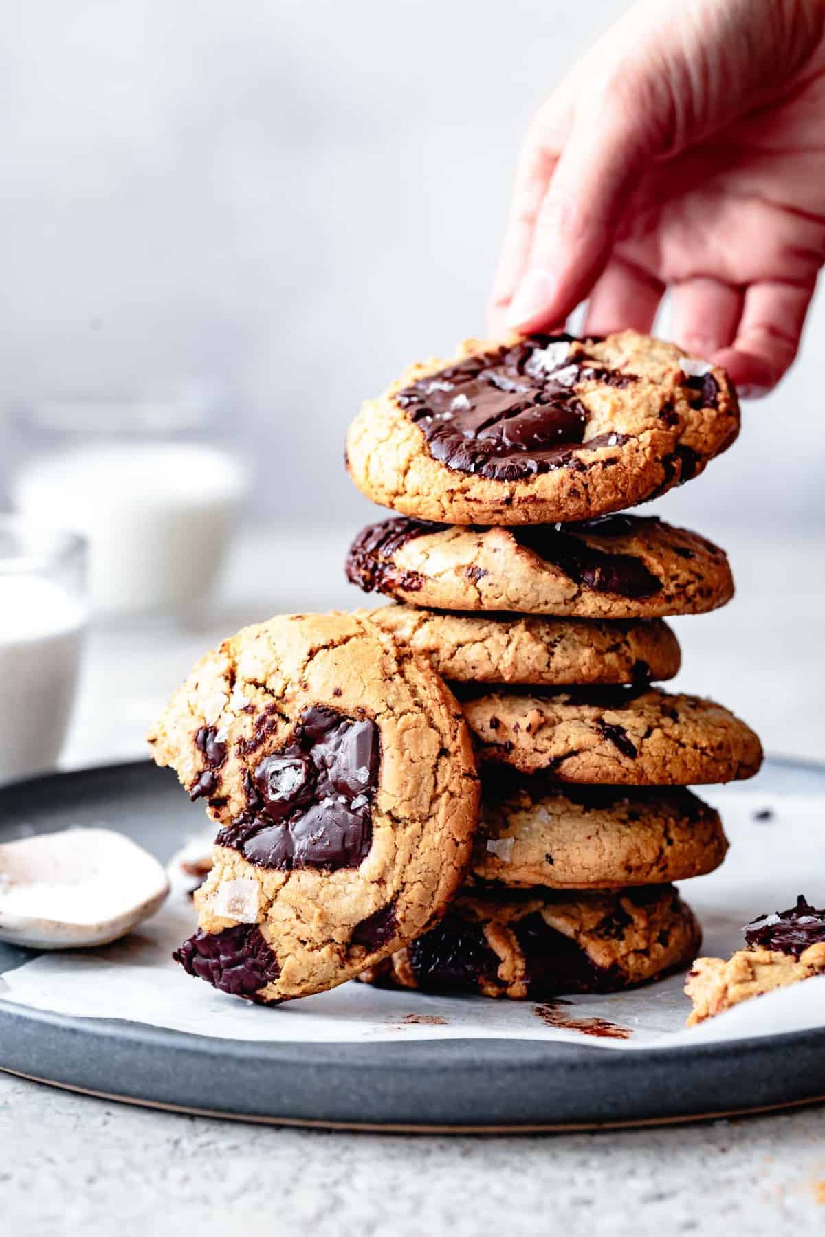 A stack of vegan grain-free chocolate chip cookies on a plate