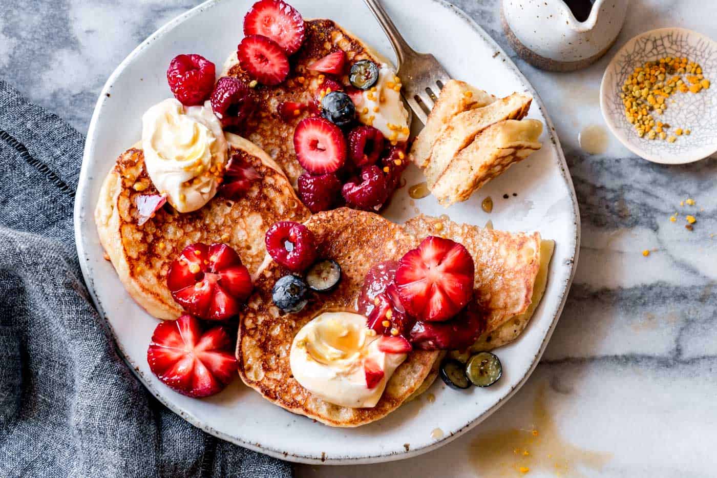 gluten-free lemon ricotta pancakes on a plate, horizontal