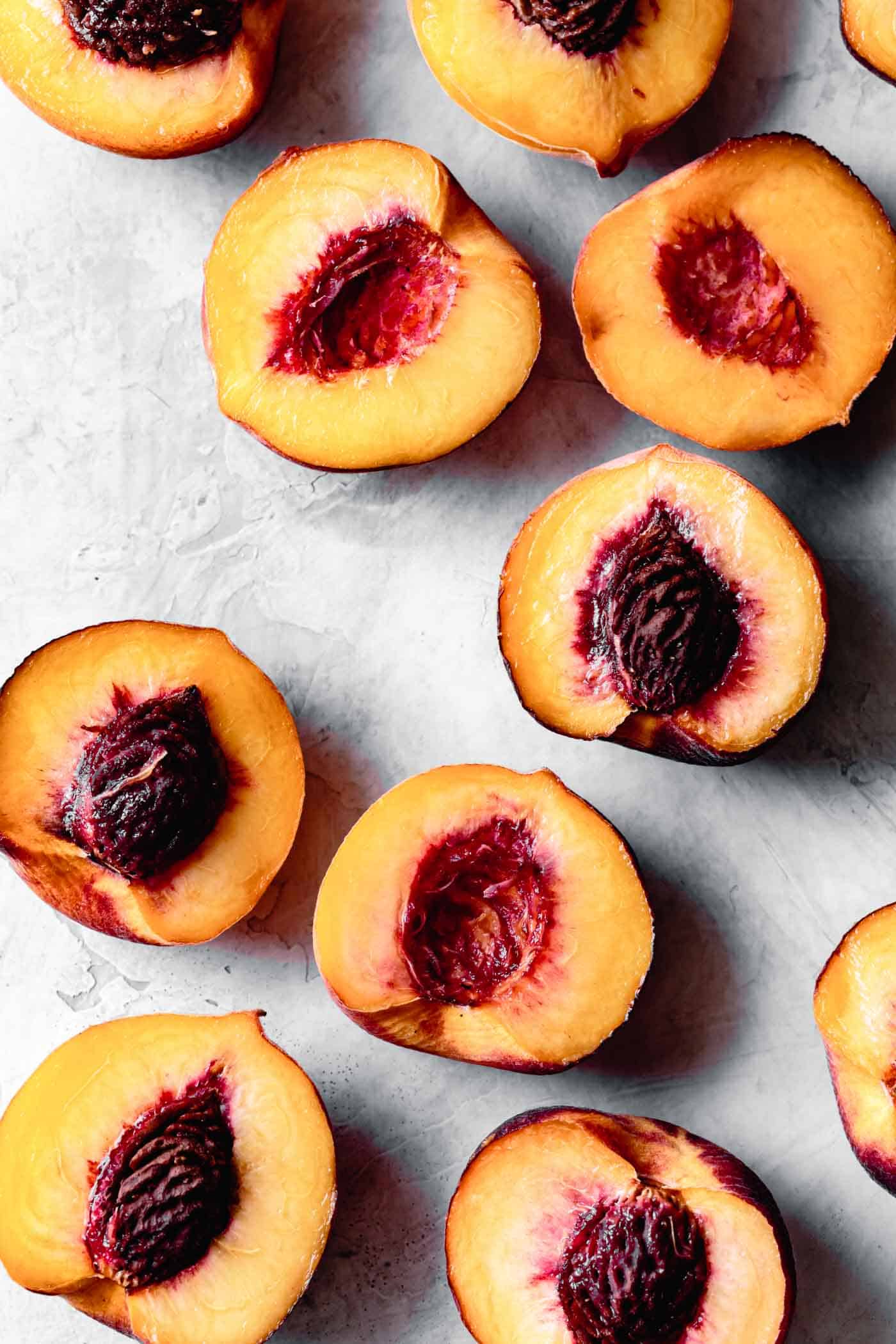 halved peaches on a work surface