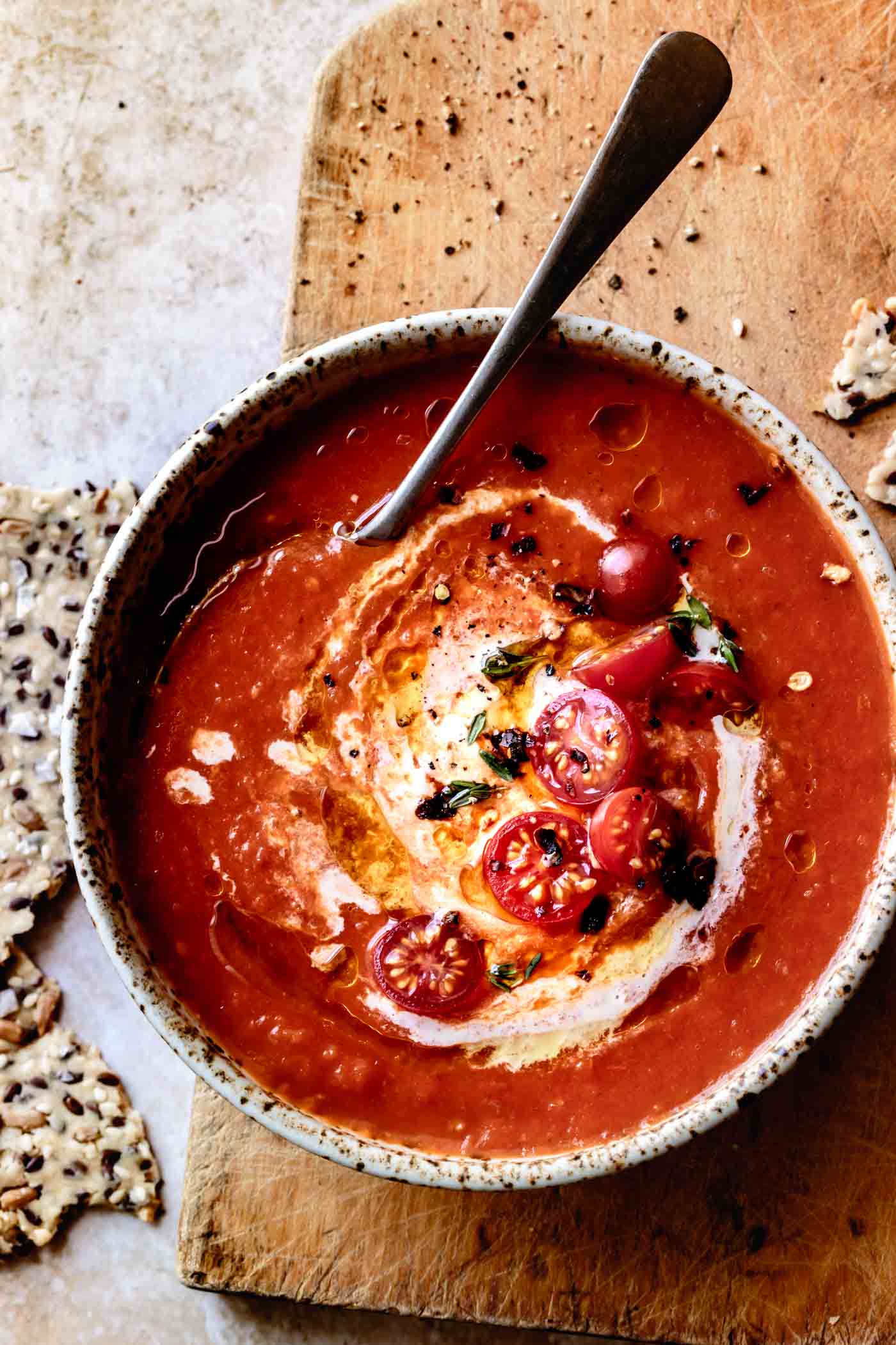 close-up of a bowl of creamy vegan tomato soup made with coconut milk and cashew cream