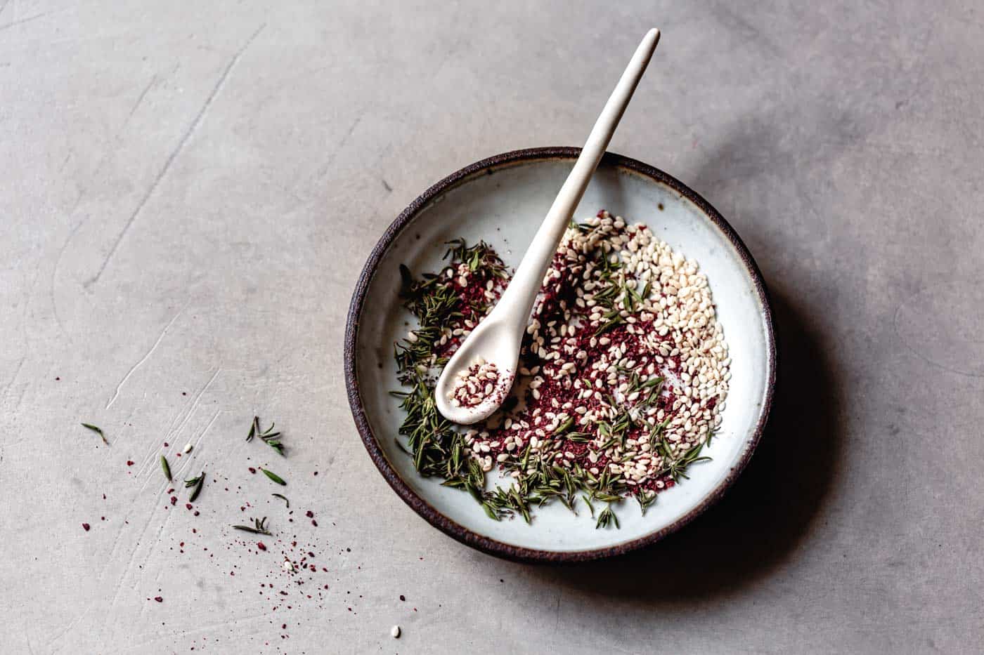 Stirring za'atar in a bowl