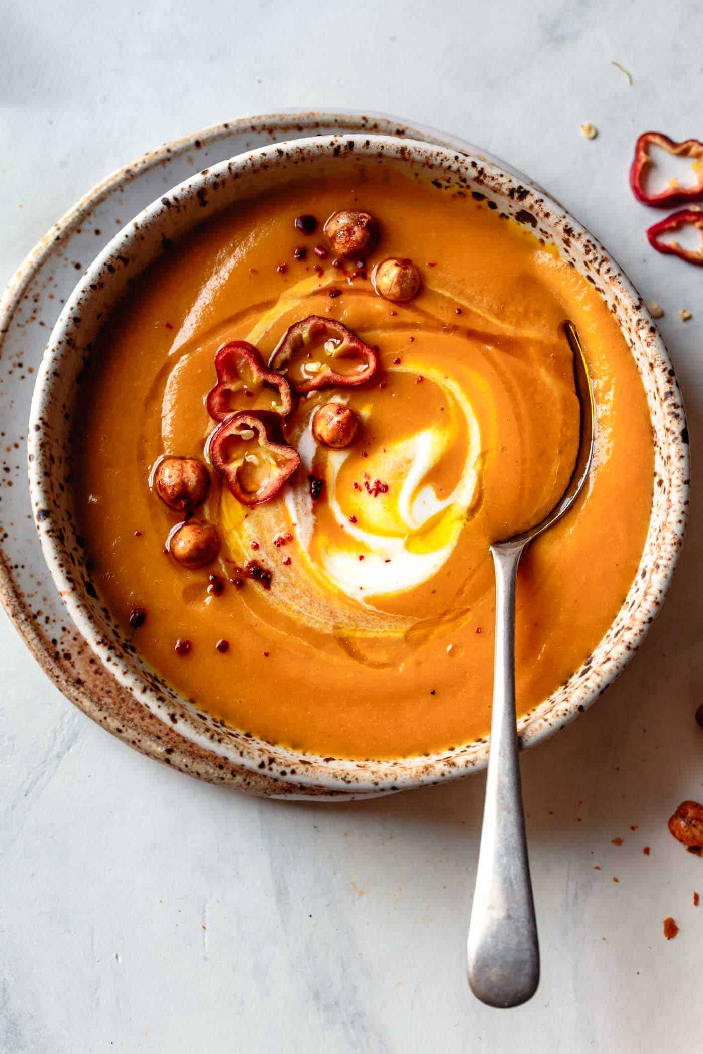 closeup bowl of carrot ginger curry soup