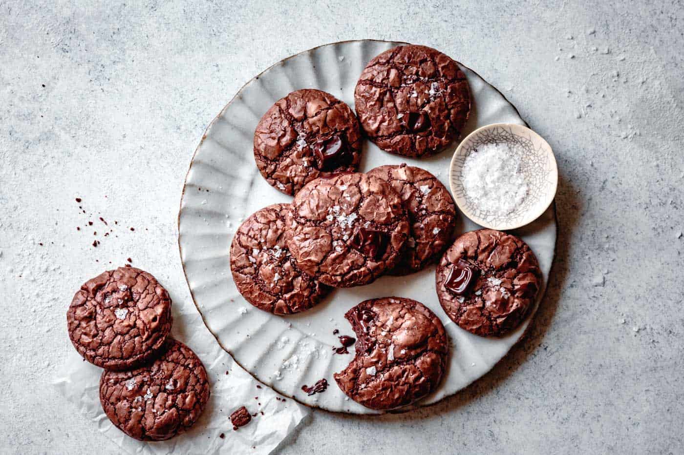 plate of fudge brownie cookies with a bit taken out