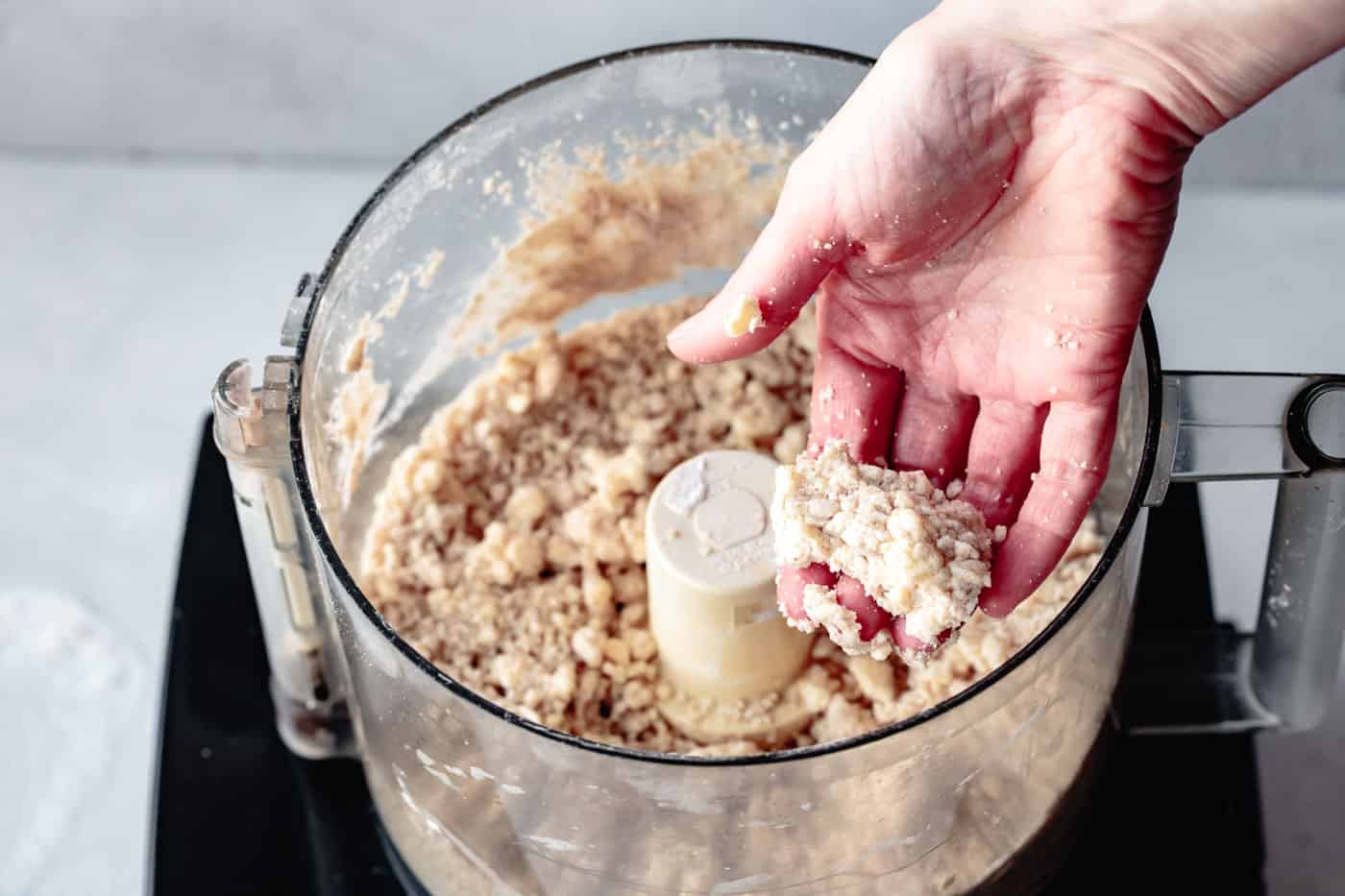 squeezing the paleo pie crust dough to determine hydration
