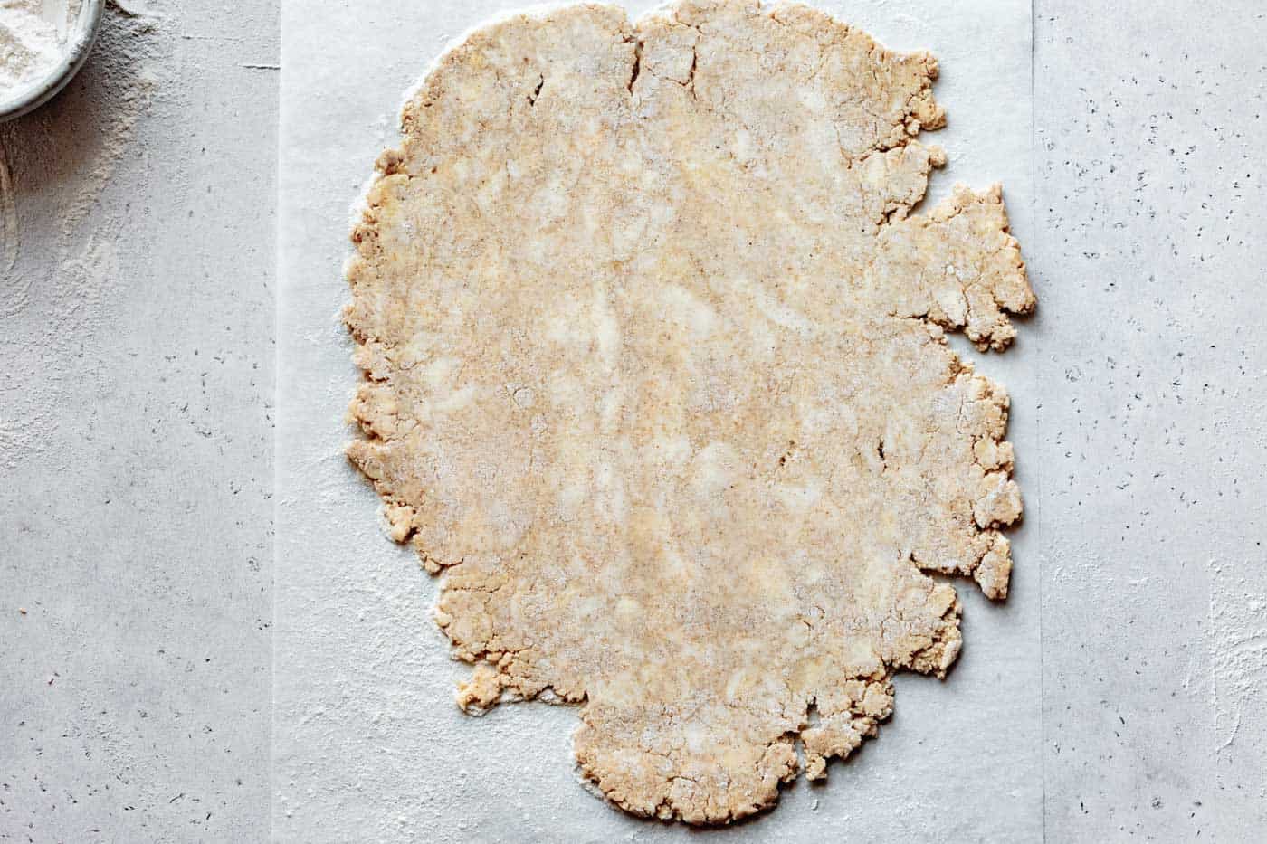 rolling out vegan almond flour pie crust