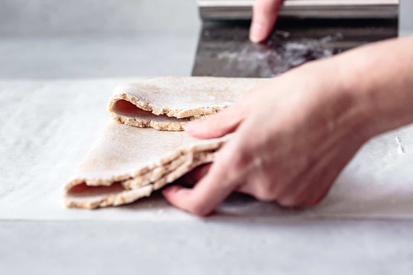 side view of folding pie dough into thirds