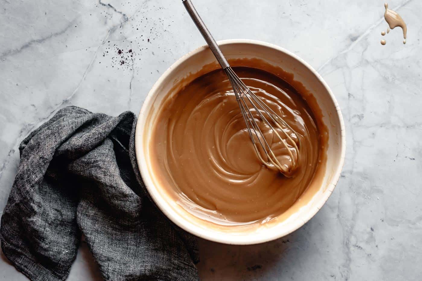 whisking wet ingredients for tahini cookies recipe