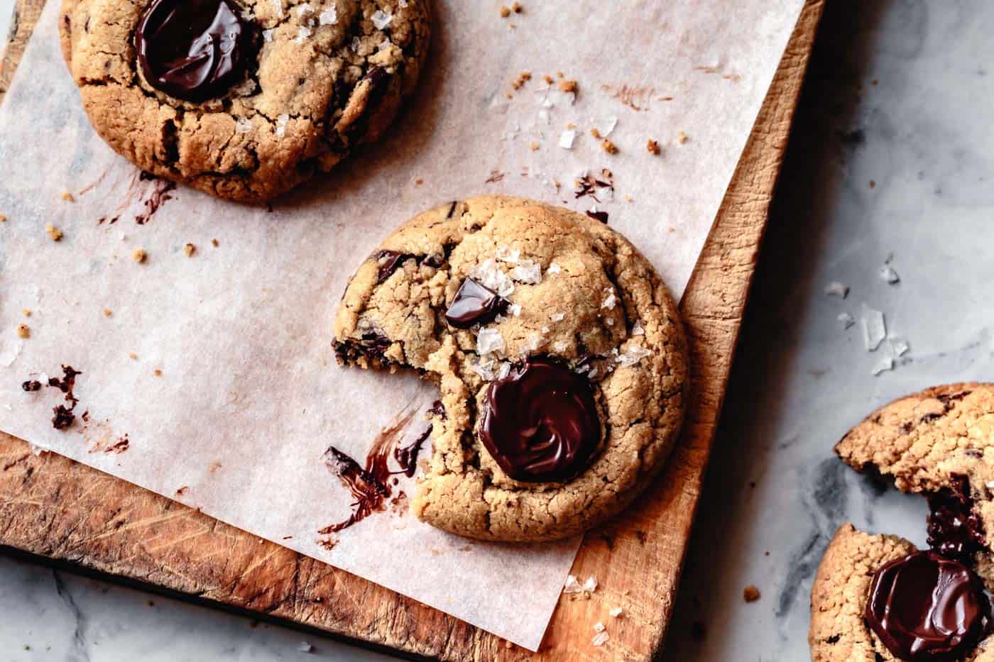 baked tahini cookies on a wood board