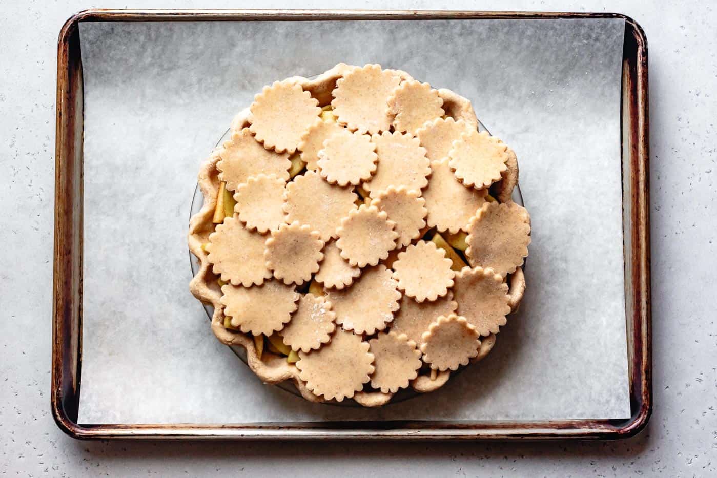 unbaked gluten-free dairy-free apple pie topped with dough rounds