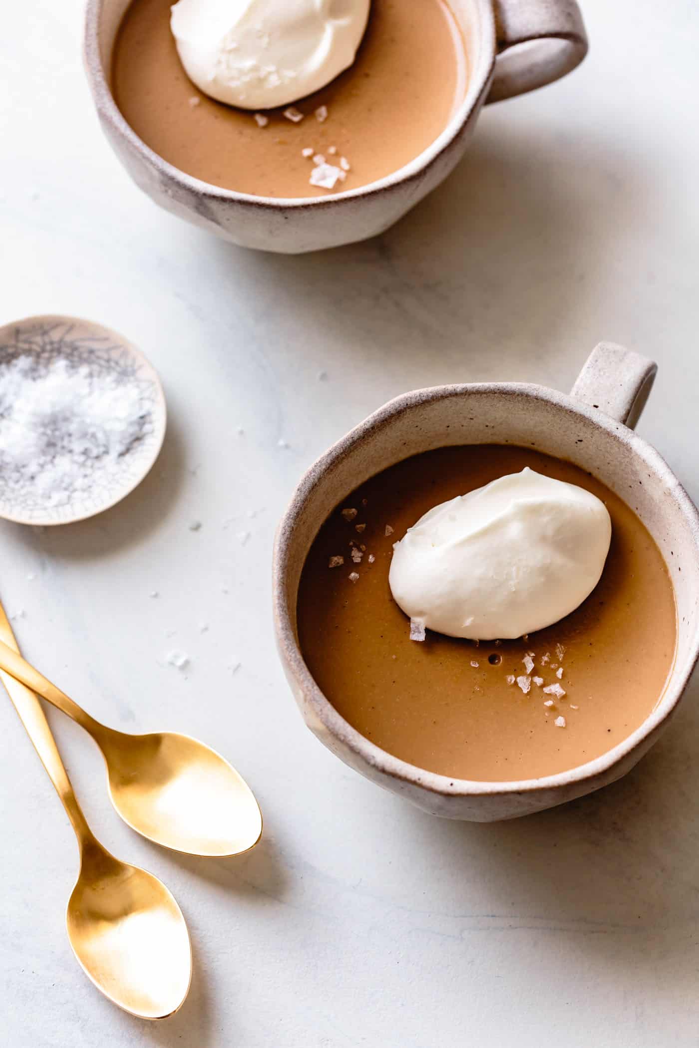 homemade butterscotch pudding in mugs, overhead