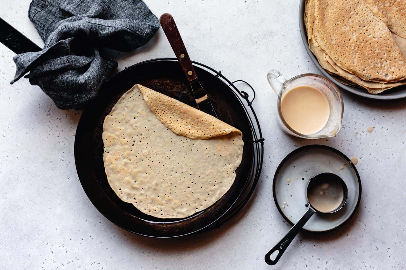 almond flour crepe cooking in a crepe pan