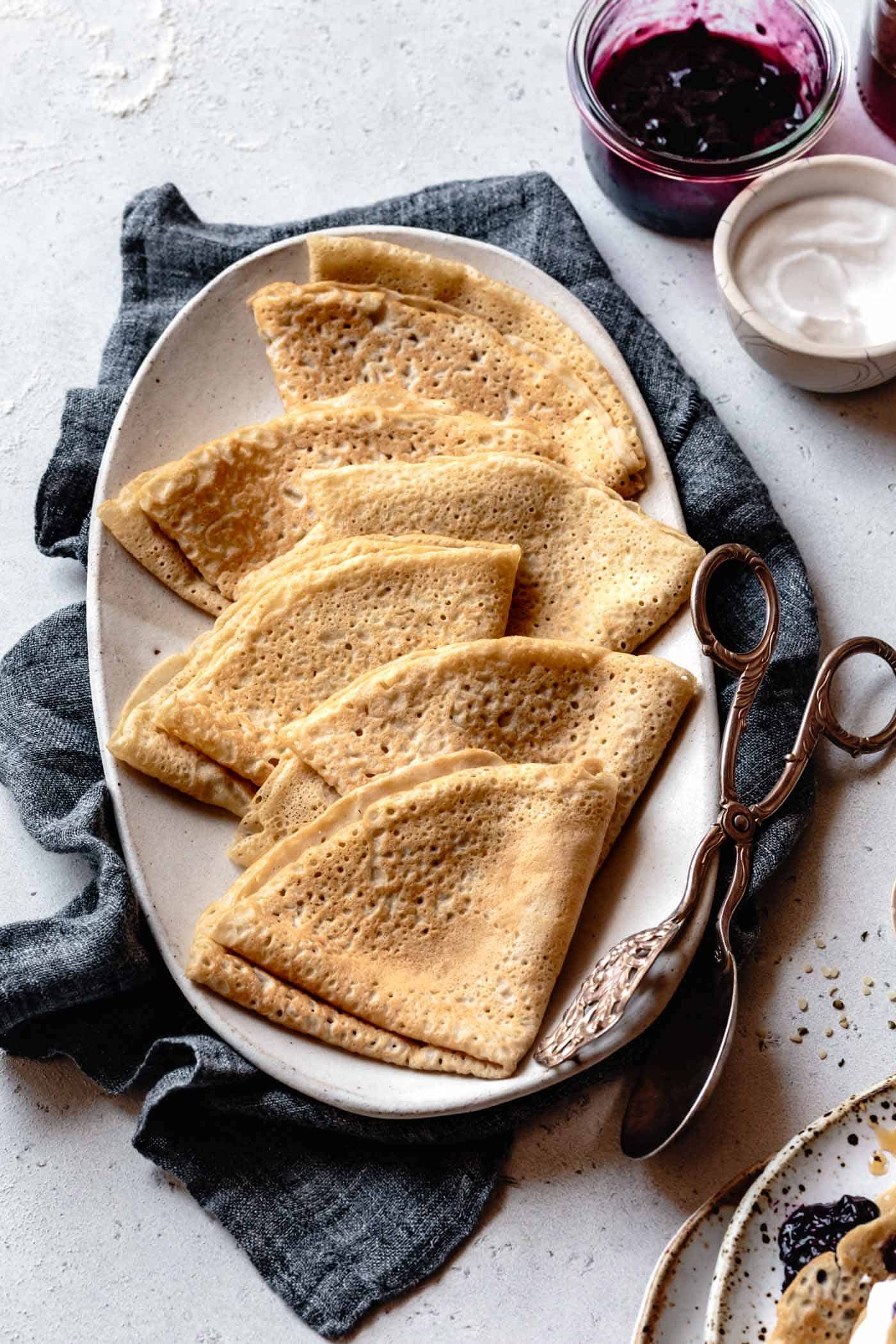 cassava flour crepes folded and stacked on a platter