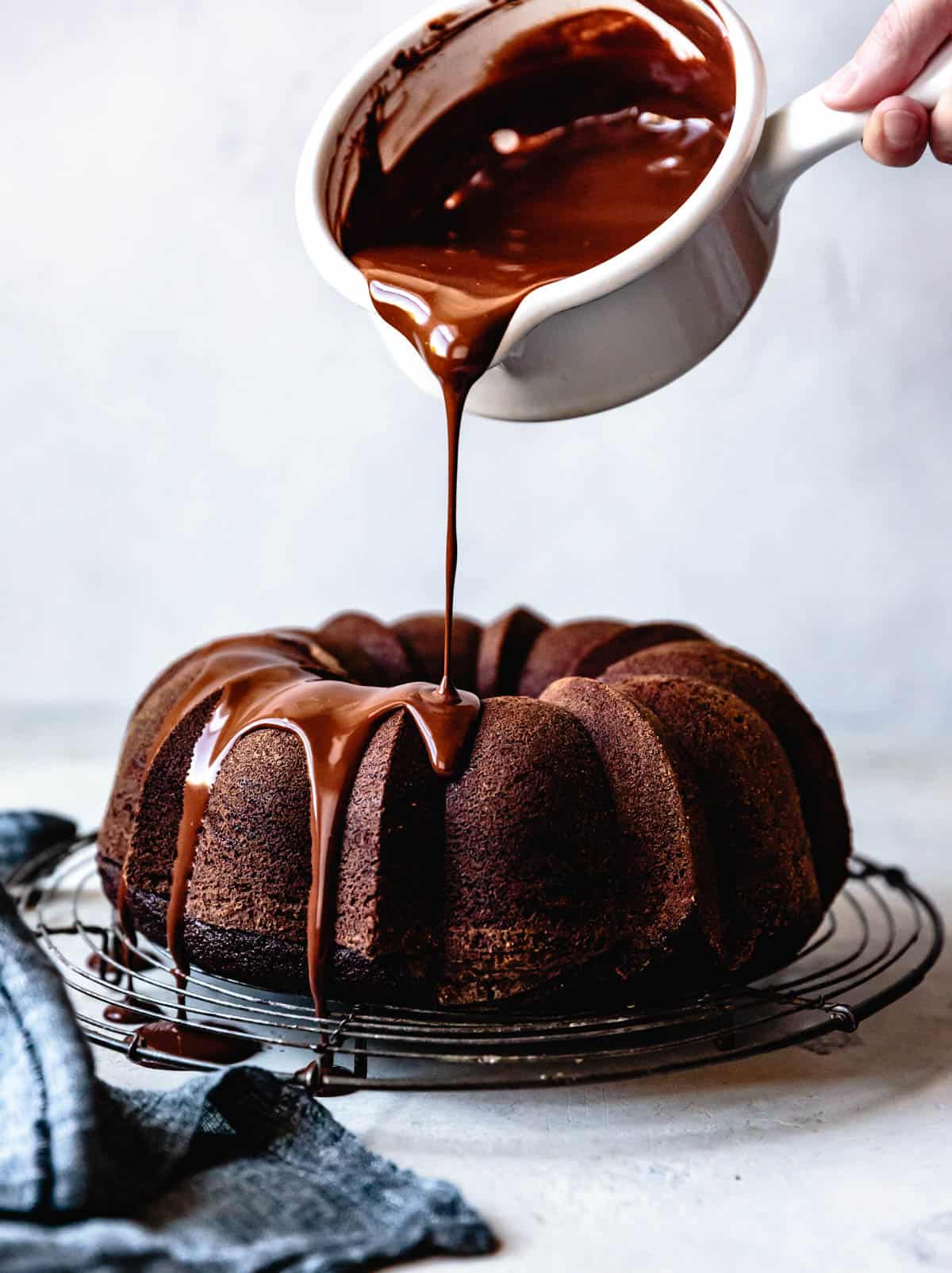 gluten-free chocolate desserts: pouring ganache over bundt cake